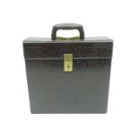 A vintage 12" vinyl record carry case with brown leather snakeskin effect
