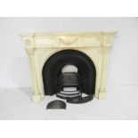 A marble effect fireplace surround along with a cast iron fireplace inset marked 'AGNEWS VB.1' to