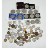 A collection of various coinage including a number of commemorative crowns
