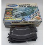 A boxed Scalextric "Ford Escort XR3i" racing set, along with a selection of spare track - untested