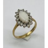 A marquise style opal ring set in 9ct gold