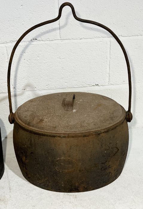 A collection of cast iron including 7 gallon pot by Kenrick & Sons, tea urn marked for Clark & Co. - Image 2 of 4