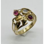 An Art Nouveau style ring set with garnets and moonstone