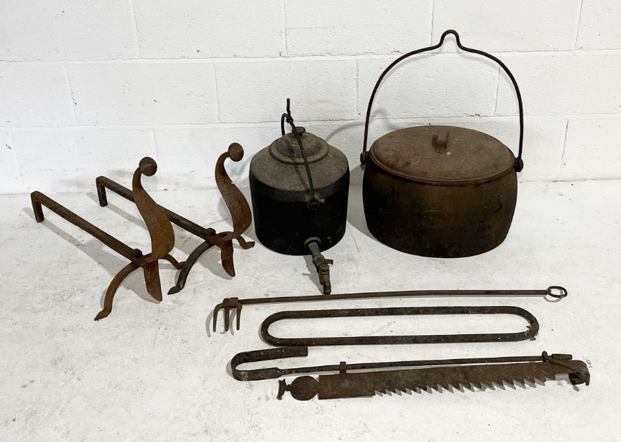 A collection of cast iron including 7 gallon pot by Kenrick & Sons, tea urn marked for Clark & Co.