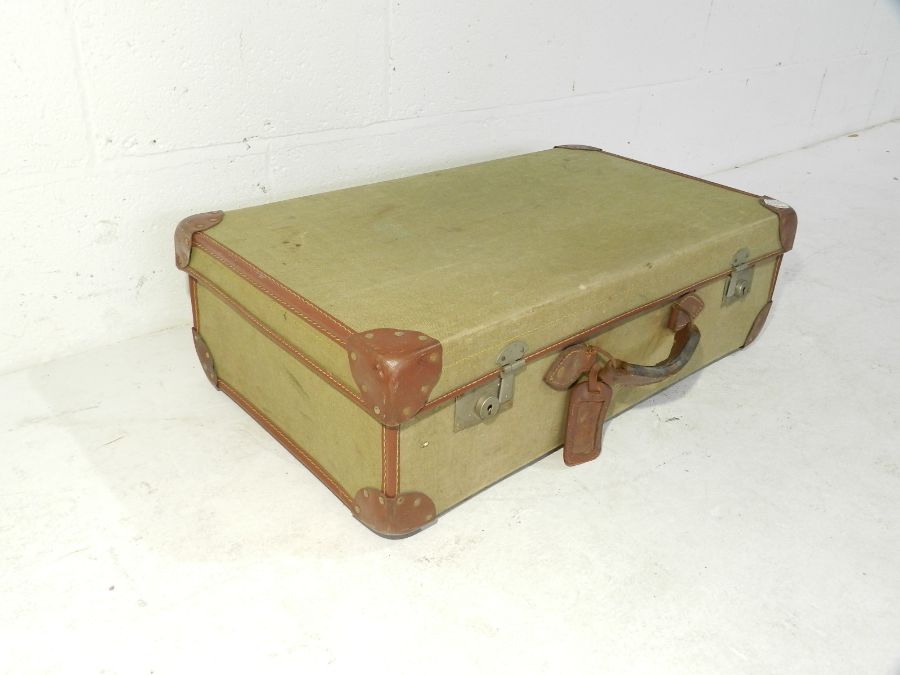 A vintage canvas and leather suitcase - Bild 3 aus 4