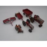 A collection of three vintage play worn die-cast tractors including a Dinky Toys, along with three