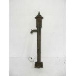 A weathered tall cast iron water pump - approximate height 150cm