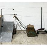 A Webb vintage lawnmower along with a galvanised wheelbarrow and a spiked aerator