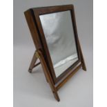An antique folding campaign mirror with integral box