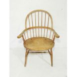 An antique stick back Windsor chair