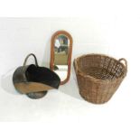 A wicker basket along with a copper coal helmet and a wall mirror