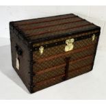 A large Louis Vuitton monogrammed steamer trunk circa 1900, wood bound with brass fittings and inner