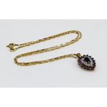 An amethyst pendant set in gold on a 9ct gold chain