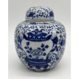 A Chinese blue and white ginger jar showing scenes of figures carrying pots, birds, flowers etc.