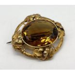 A Victorian unmarked gold (tested 14ct) brooch set with a large quartz stone