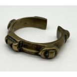 A small bronze bangle, possibly tribal