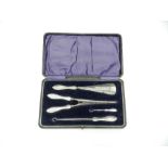 A cased set of hallmarked silver handled ladies accessories