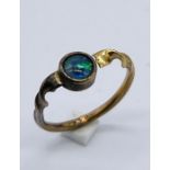 An 18ct gold ring set with an opal A/F, total weight 2.1g