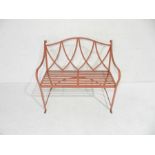 A red painted modern strap work wrought iron garden bench - length 102cm