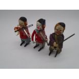 Three vintage Schuco clockwork tinplate toys in the form of clowns playing the violin (one with an