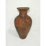 A large weathered terracotta urn - height 73cm