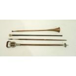A silver topped walking stick along with a tribal metal tipped spear, copper hunting horn and a