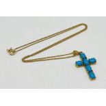 A 9ct gold cross set with turquoise on a 9ct gold chain