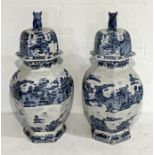 An impressive pair of blue and white Chinese lidded temple jars with Dogs of Fo finials - overall