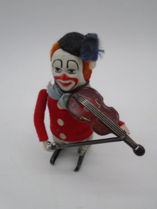 Three vintage Schuco clockwork tinplate toys in the form of clowns playing the violin (one with an - Image 8 of 11