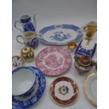 An assortment of Oriental and blue and white china etc in a wicker basket.