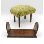 A small upholstered stool along with a sliding book rest