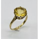 A 9ct gold ring set with a citrine