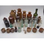 A collection of stoneware jars and a flagon, along with a selection of antique and vintage glass