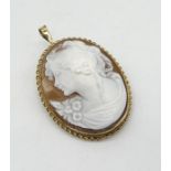 A cameo brooch/pendant set in 9ct gold