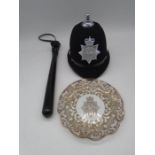 A vintage Devon & Cornwall Constabulary police officers helmet, along with a truncheon and