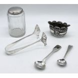 A small collection of hallmarked silver including a salt, dressing table pot etc.
