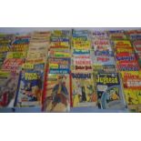 A collection of worn vintage comics, including Blondie, Teenage Love, Classics Illustrated, Wyatt