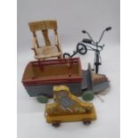 Two wooden pull-along toys including a truck and Walt Disney Winnie the Pooh, along with a small