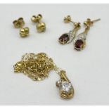 A 9ct gold pendant on fine 9ct chain along with two pairs of 9ct gold earrings