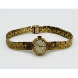 A ladies Bueche Girod 9ct wristwatch with rolled gold strap