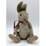 A Steiff rabbit with squeaker, mohair fur and silver button to ear