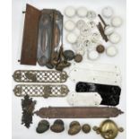 A collection of antique door furniture including lattice door handles, a large finger plate by W&R