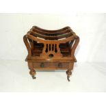 A Victorian rosewood Canterbury, with single drawer