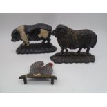 Three cast iron doorstops, all in the form of farm animals