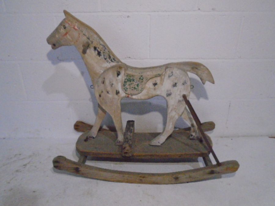 An antique child's wooden rocking horse