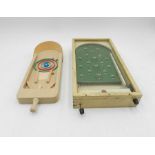 A vintage miniature bagatelle game along with one other similar