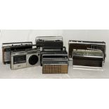 A collection of vintage radios including Hacker, Roberts, Grundig, Omega etc.