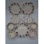 A collection of Emma Bridgewater dining plates, sandwich plates and four small bowls. Patterns