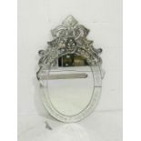 A Venetian style oval wall mirror (one part loose but present) - height 100cm, length 62cm