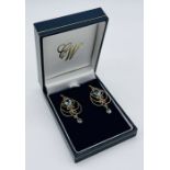 A pair of 9ct gold earrings set with topaz